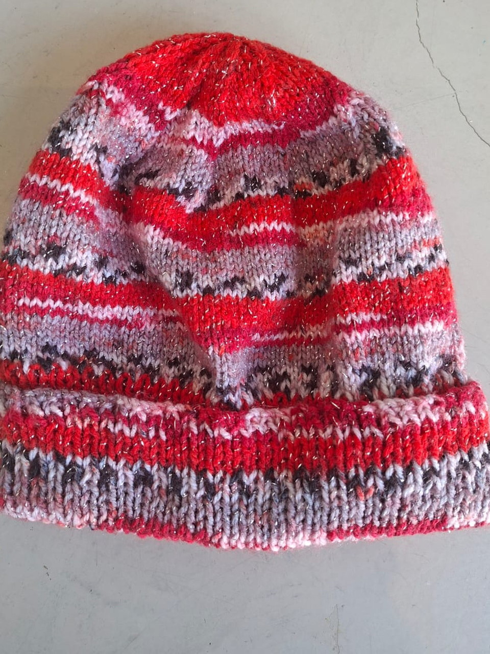 Red, pink and grey fleck beanie with metallic thread, hand-knitted at Kranshoek