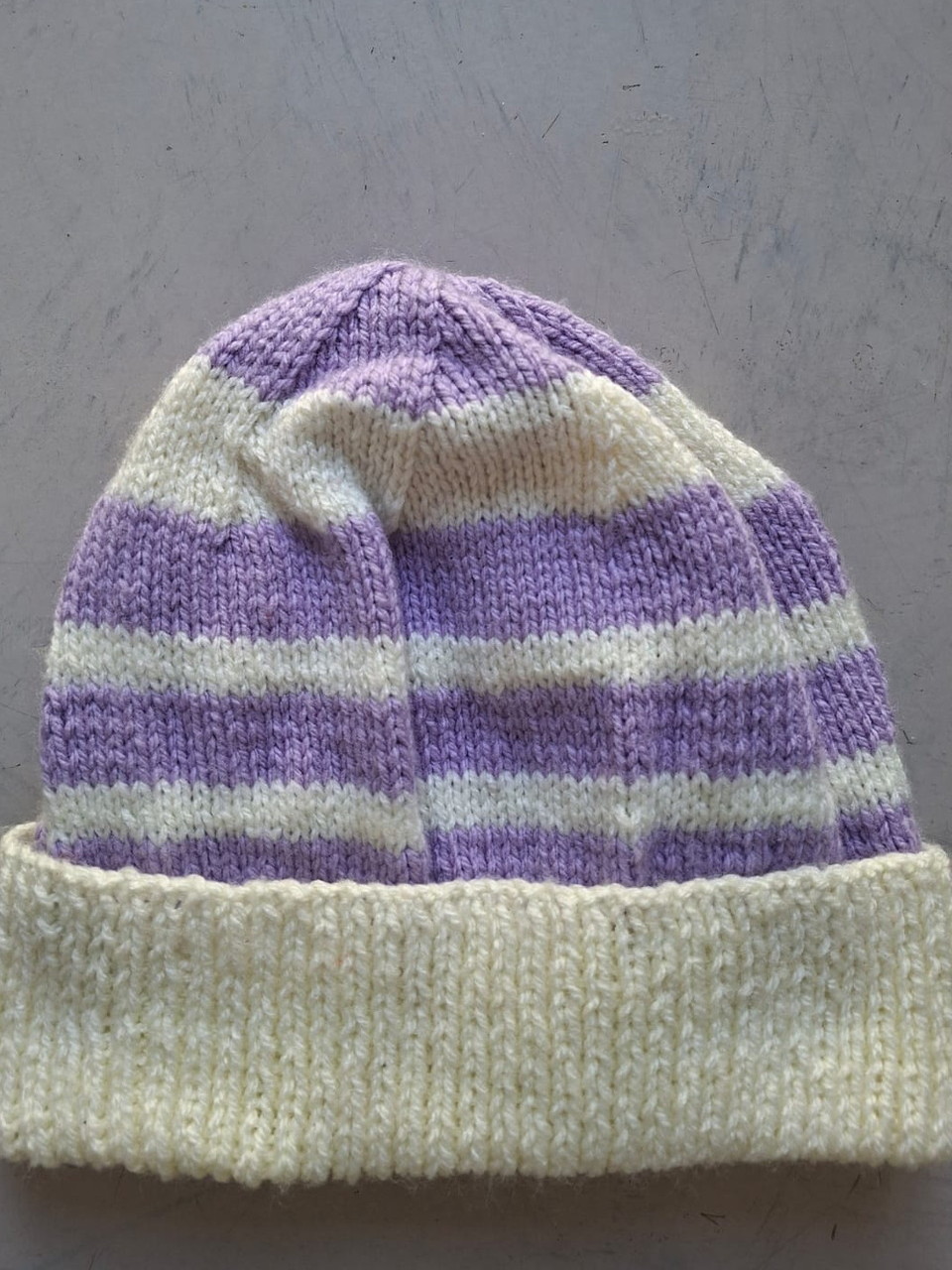 Lilac and cream striped beanie, hand-knitted at Kranshoek