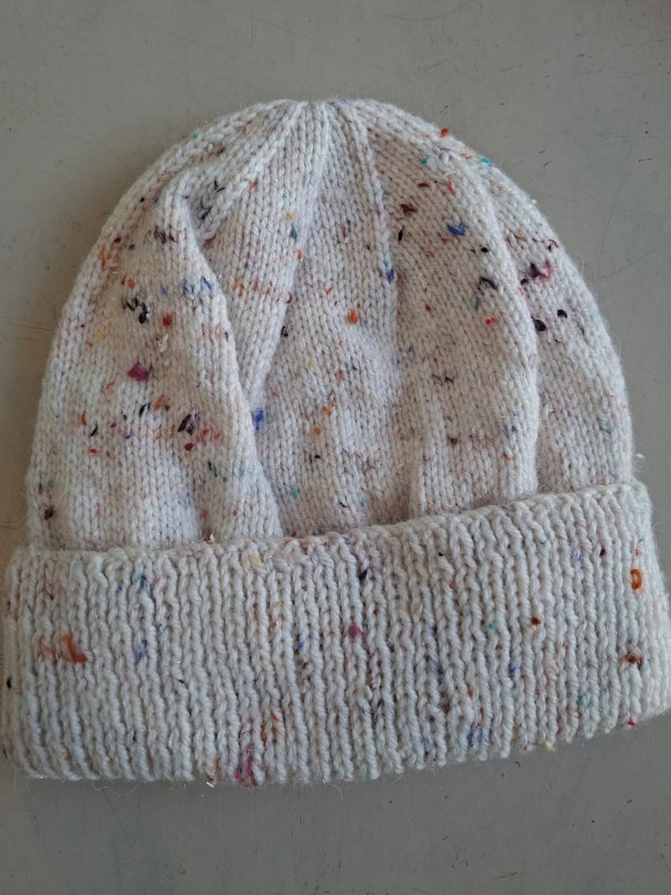 Cream fleck beanie, hand-knitted at Kranshoek