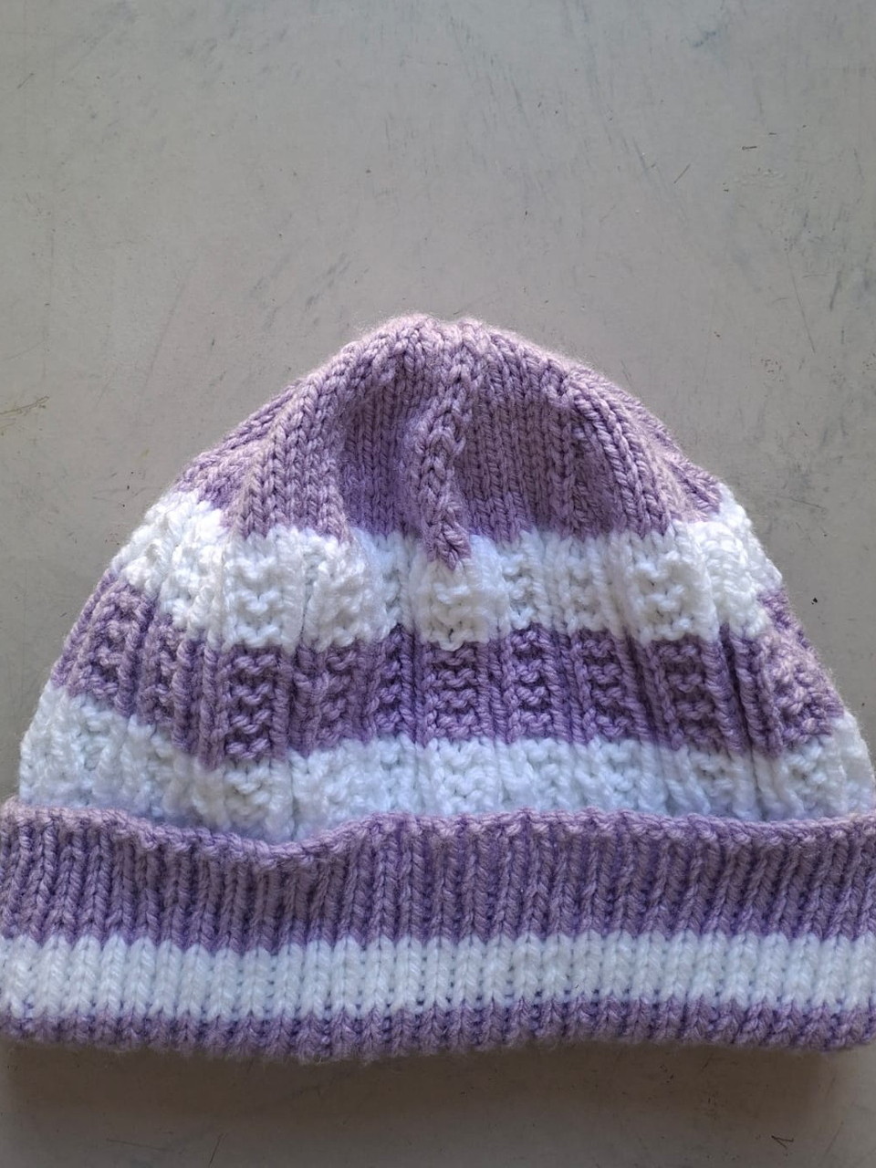 Lilac and white striped beanie with a lilac cuff, hand-knitted at Kranshoek