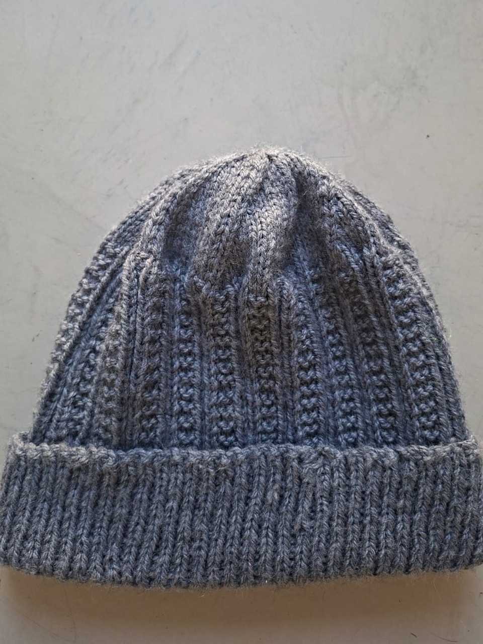 Solid mid grey ribbed beanie, hand-knitted at Kranshoek