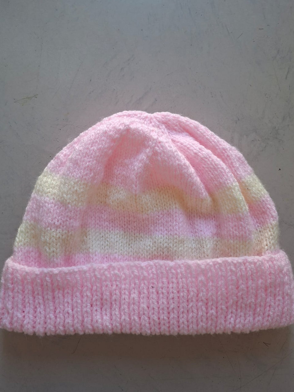 Pink variegated beanie with lemon and green flecks, hand-knitted at Kranshoek